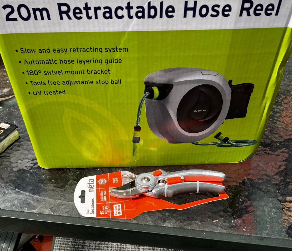 Retractable hose and a pair of brand new secateurs 