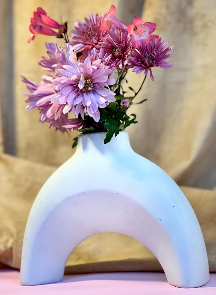 pink flowers in white vase 