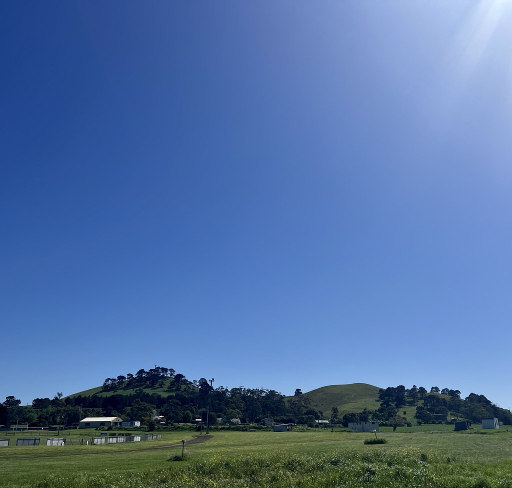 Bright clear skies over a mountain